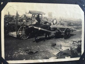 Helm Brothers uses horse carts to bring in lumber for the reconstruction of Helm Brothers' Yokohama headquarters